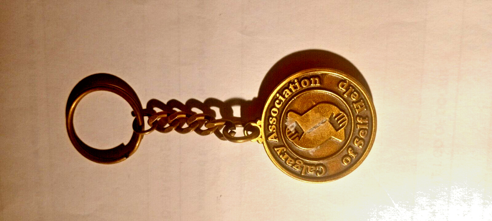 Key Chain Bronze Calgary Association of Self Help, Beautiful Cutting Round Shape