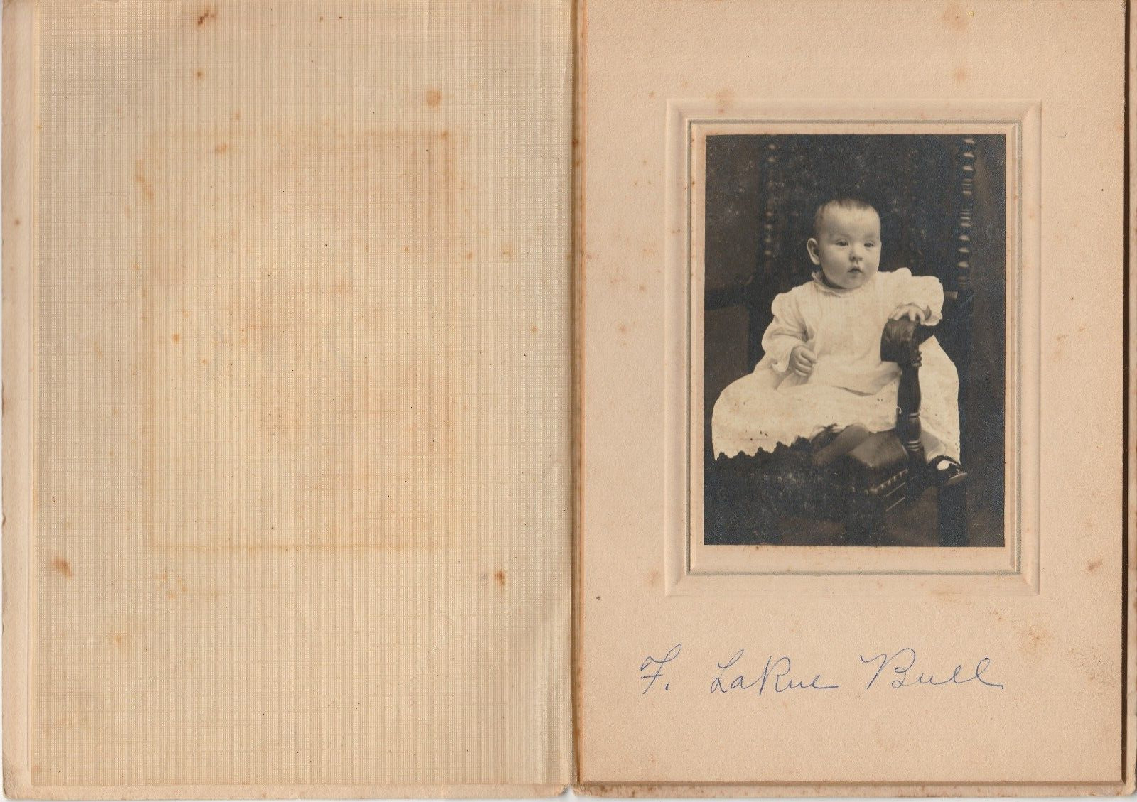 Baby Boy in Dress Photograph in cardboard frame Surname Bull F. LaRue Antique