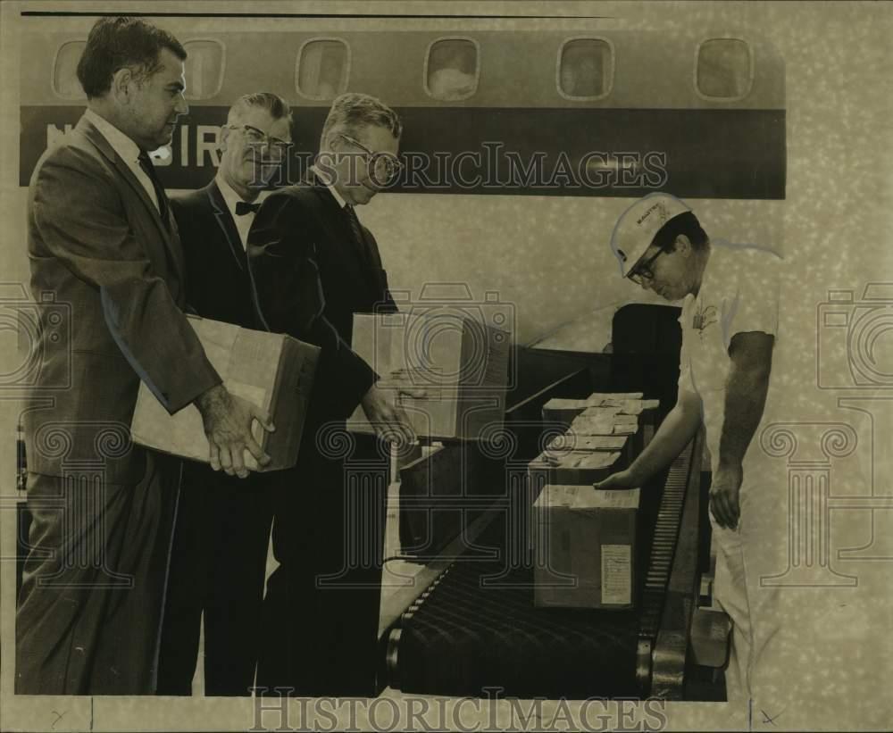 1967 Press Photo Inspecting a shipment of measles vaccine- K.O. Measles campaign