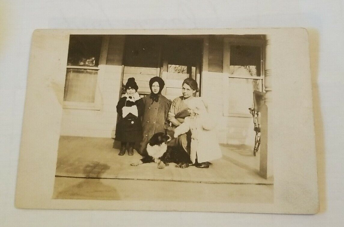 Real Photo Postcard of a Family in front of their Home