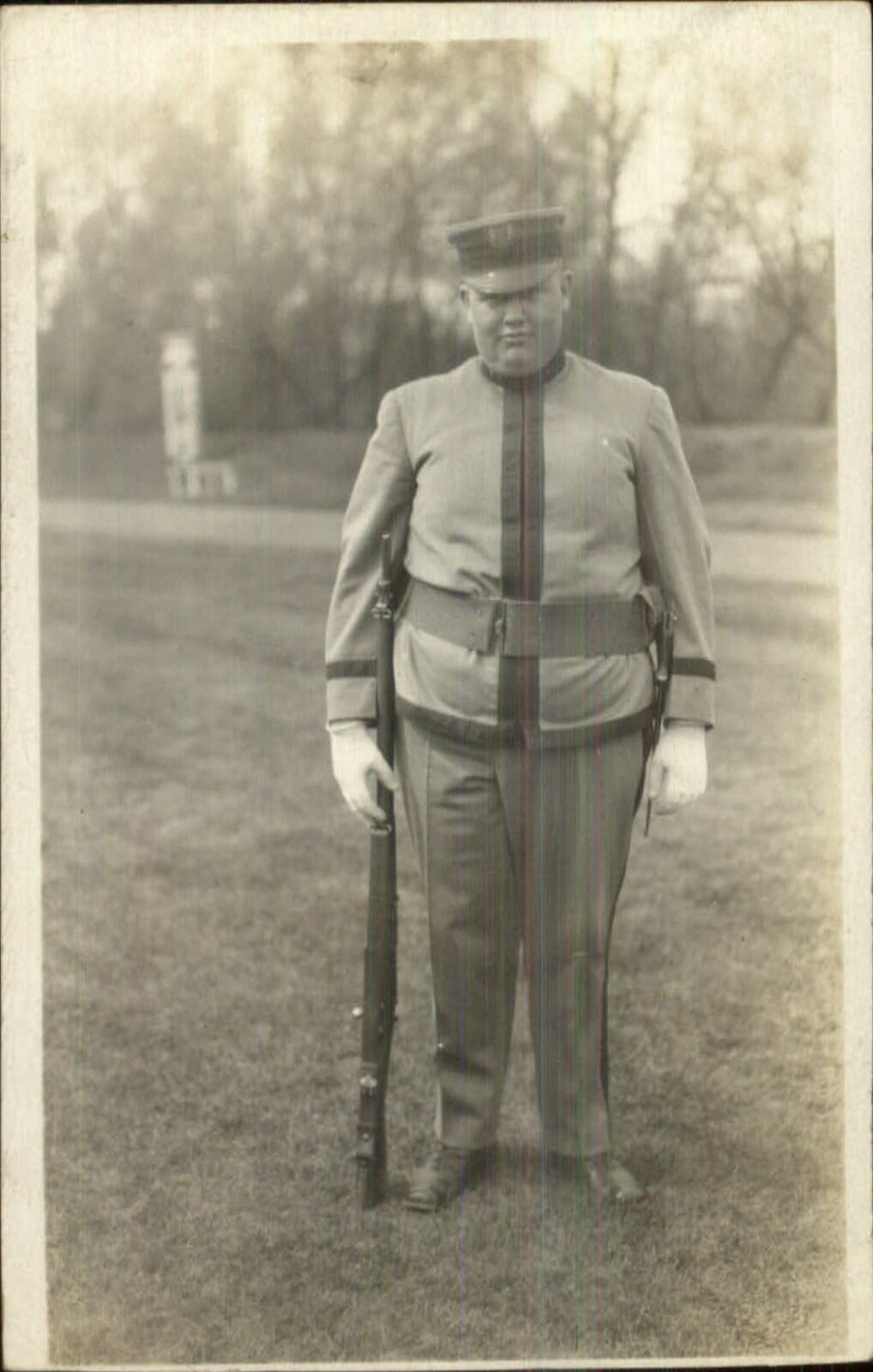 Pudgy Obese Soldier Cadet Uniform Gun Rifle c1910 Real Photo Postcard