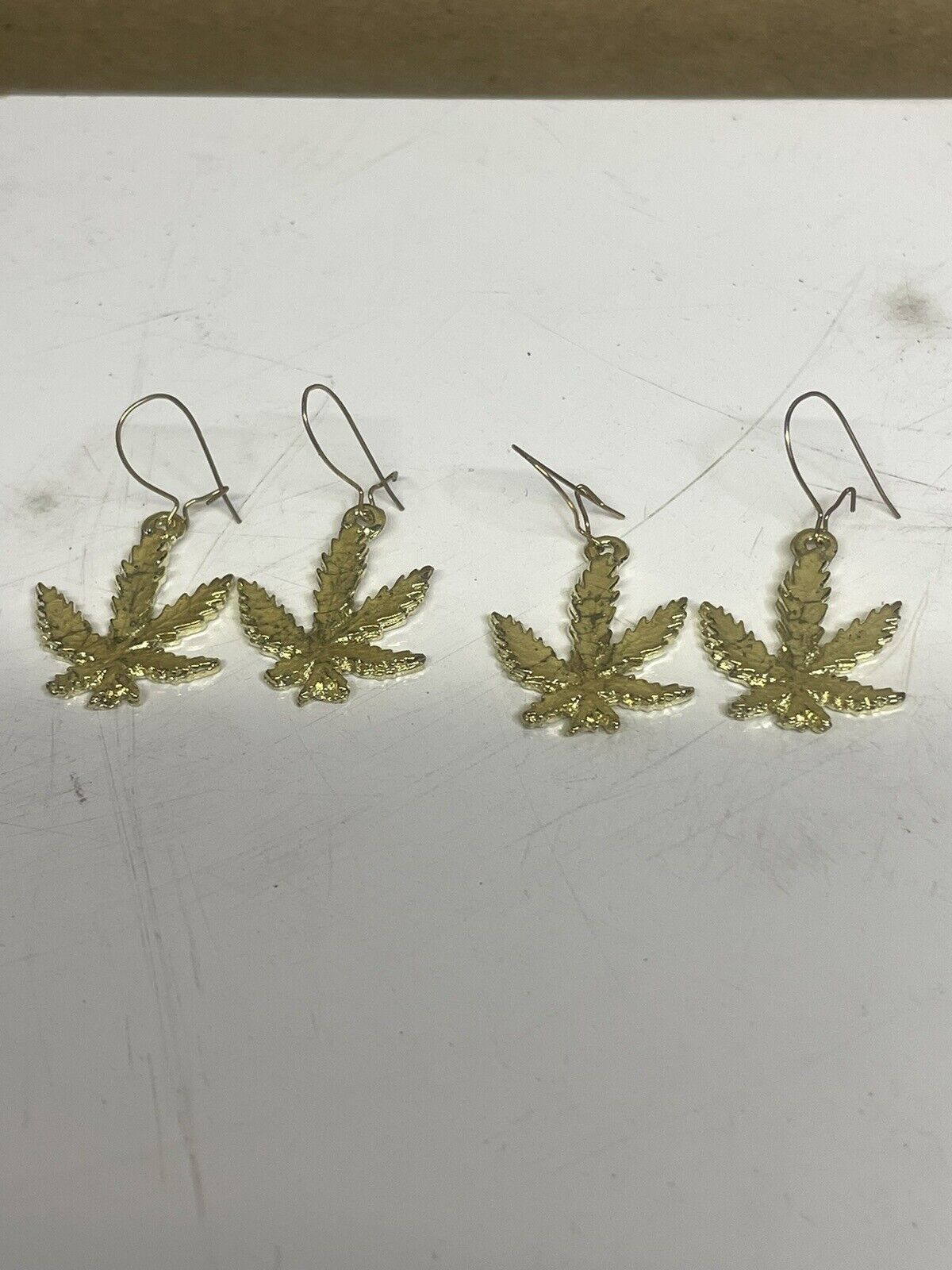 Set of 2 Vintage marijuana Leaf  Earrings Set Gold Colored Unused 1970's