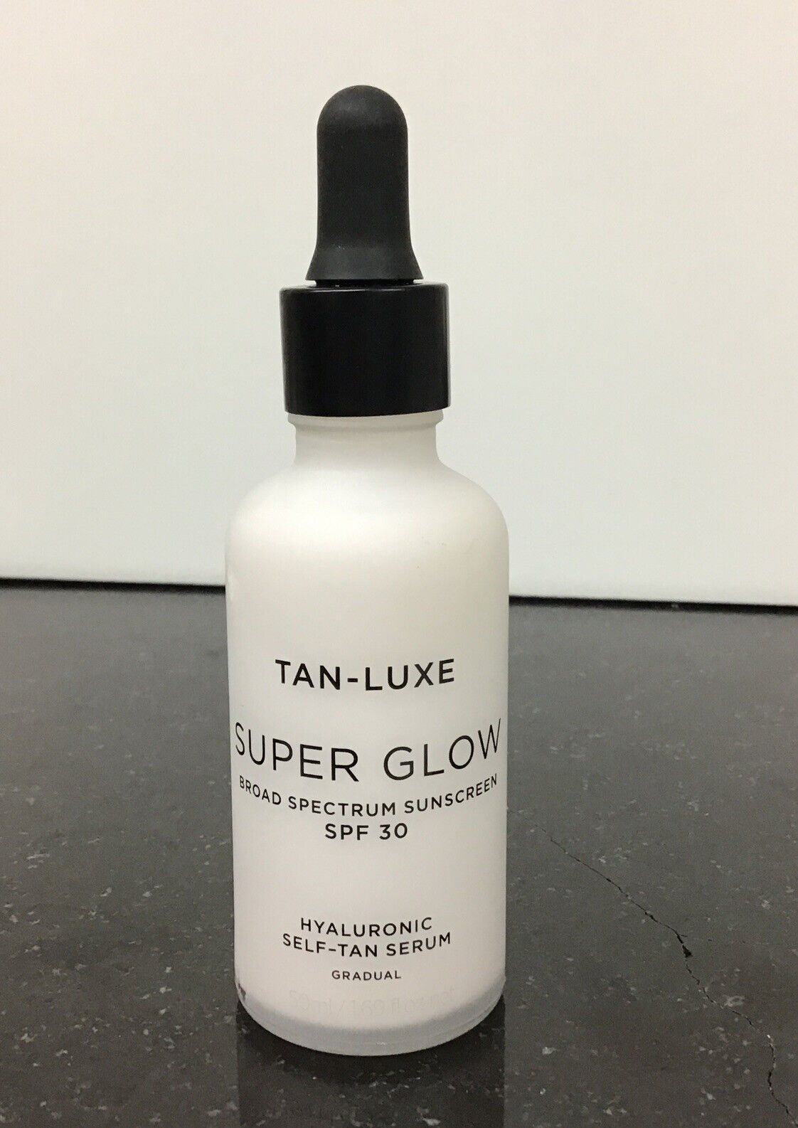 TAN LUXE Super glow broad spectrum sunscreen SPF 30 1.69 oz/ 50 ml.