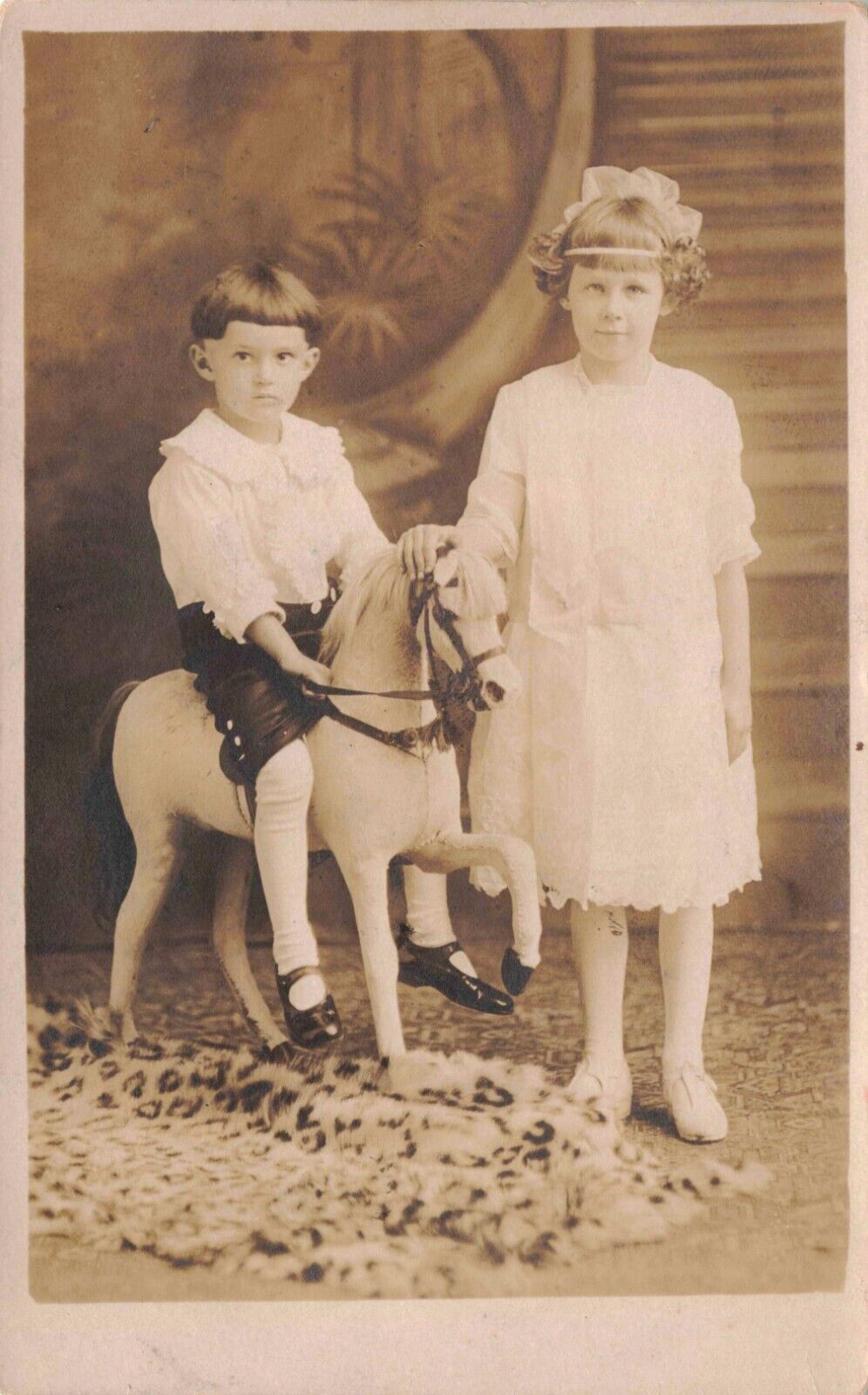 RPPC Boy Rides Studio Prop Horse with Sister in Vintage Portrait Postcard