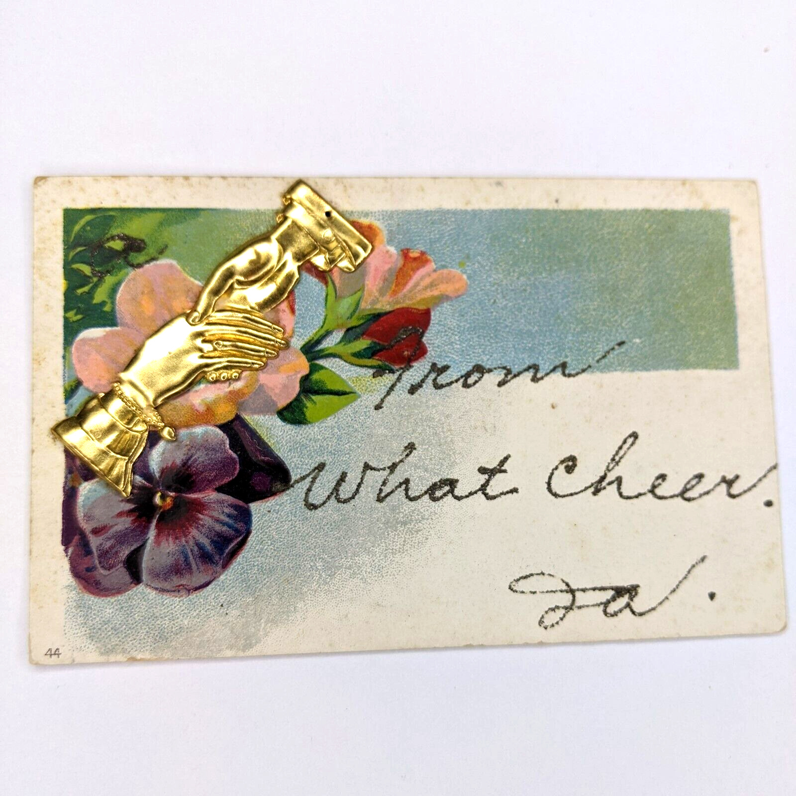 c1910s What Cheer, IA Metal Embossed Gold Hands Novelty Handmade Postcard A175