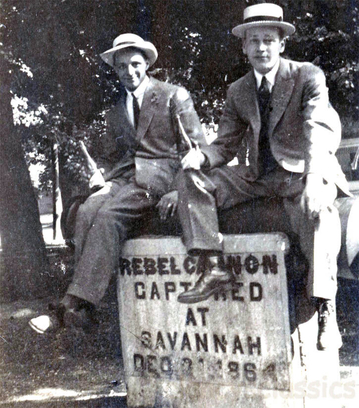 1918 Two Young Men Sit on Rebel Cannon Captured at Savannah Georgia