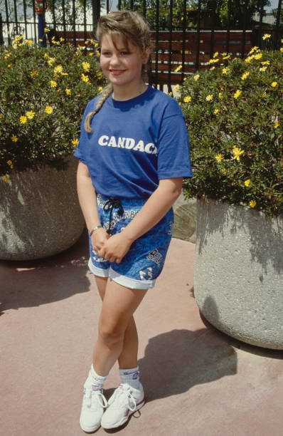 America child actress Candace Cameron wearing a blue t-shirt \'Cand- Old Photo