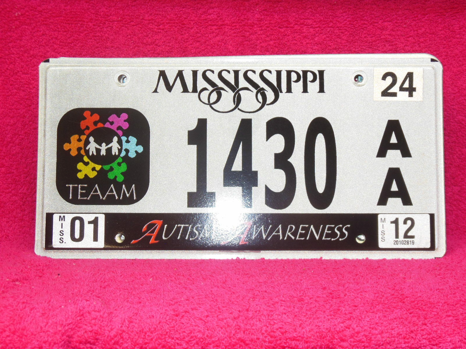 1430 AA = January 2012 Mississippi Autism Awareness License Plate 