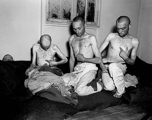 Liberated prisoners from the camp at Buchenwald point to the numbe- Old Photo
