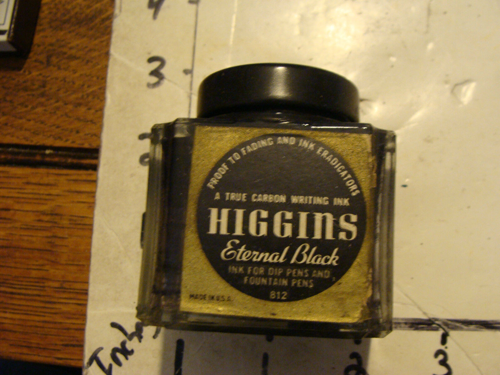 old HIGGINS eternal black glass jar and lid, 2 oz.  cool bottle.