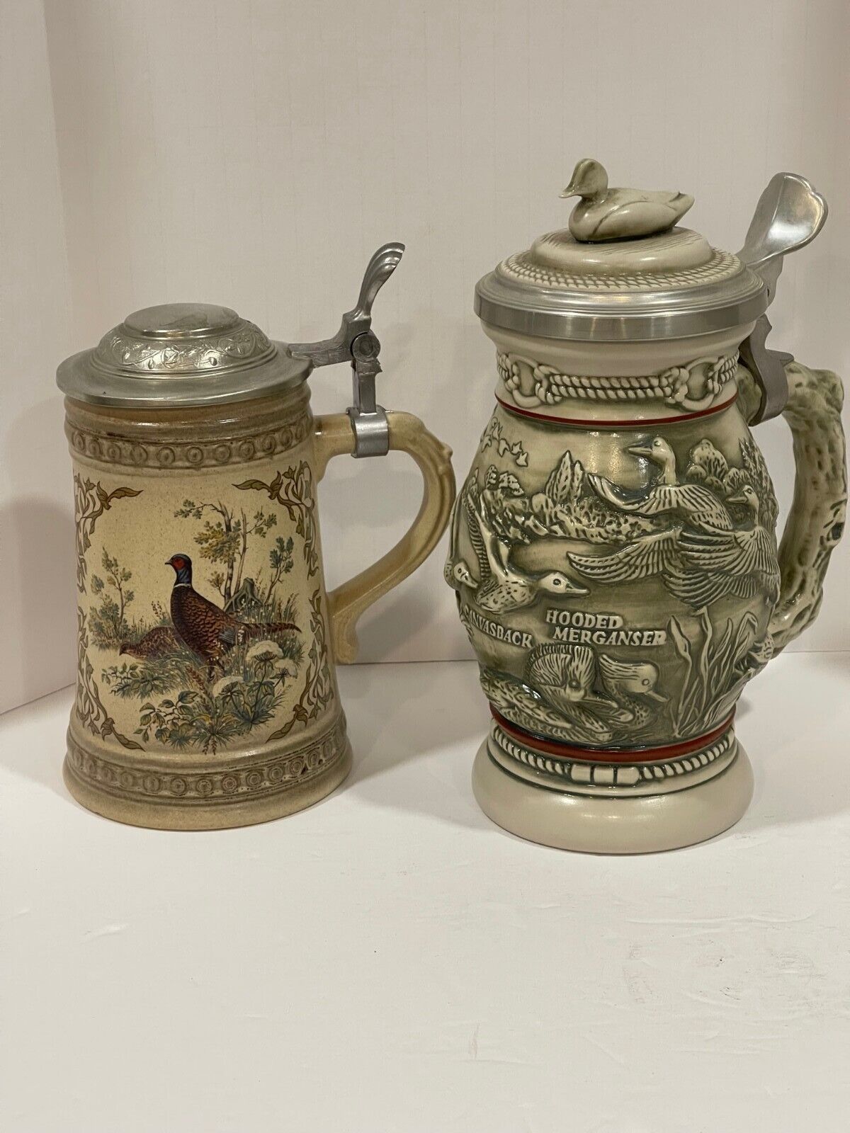 Vintage set of Two Duck and Pheasant beer steins with lids
