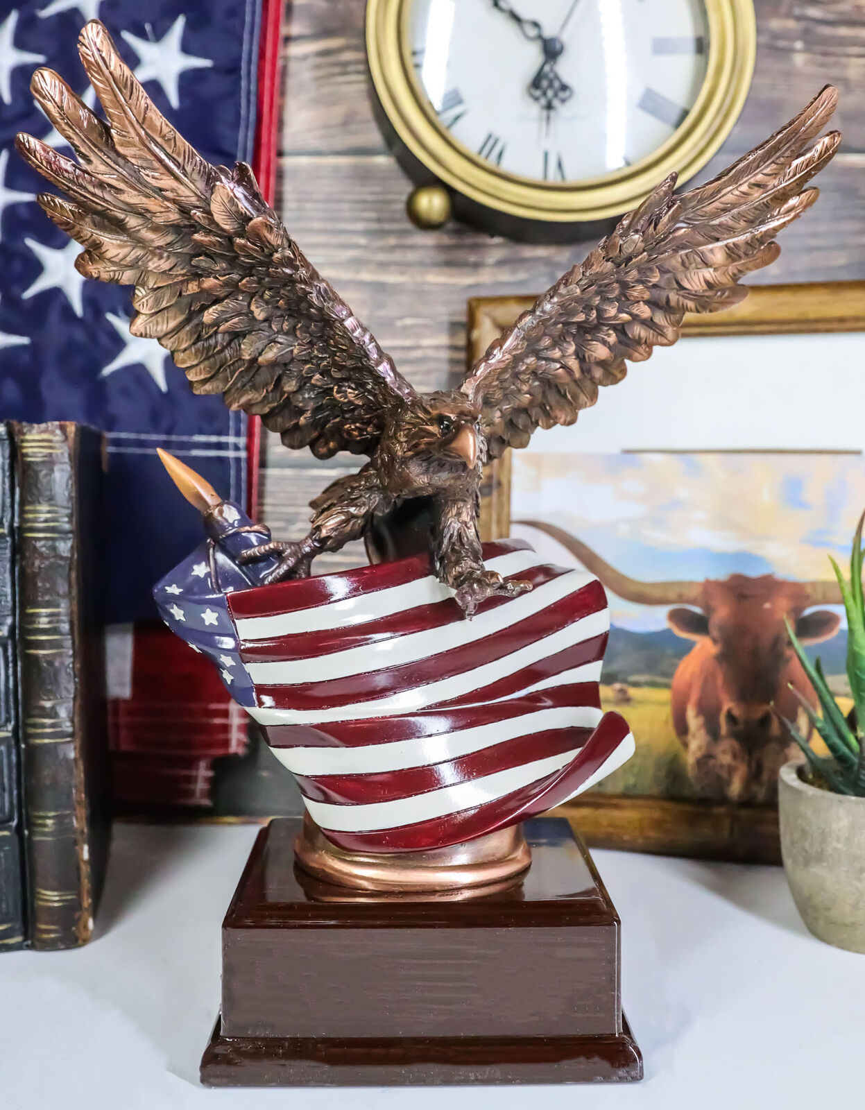 Patriotic Bald Eagle With Spread Out Wings Clutching On American Flag Statue