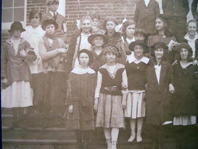 CIRCA 1915 CLASS PHOTO ONE GIRL WITH GIRL SCOUT HAT MIXED CLASS DEMOGRAPHICS
