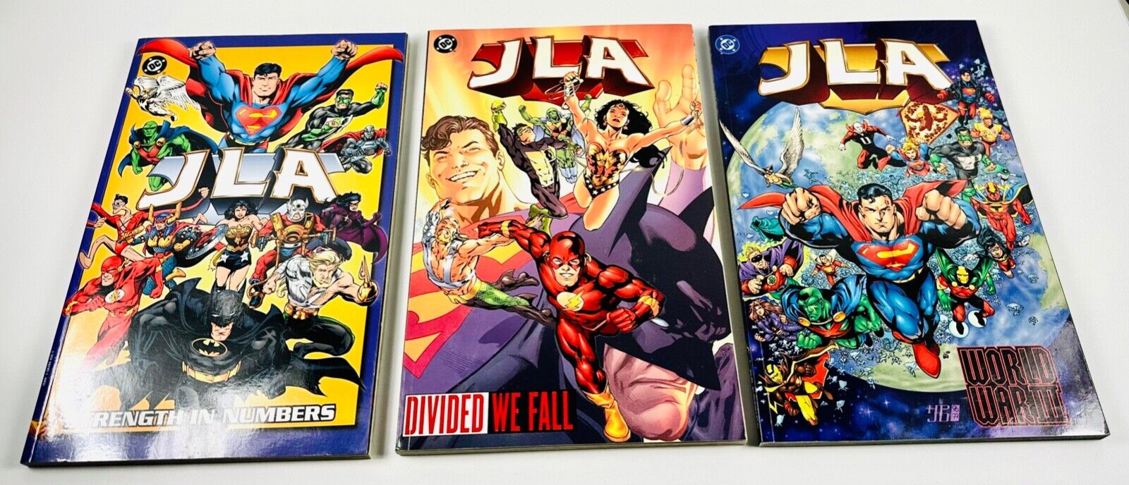 DC Comics JLA - Strength in Numbers, Divided We Fall, World War III - MINT COND