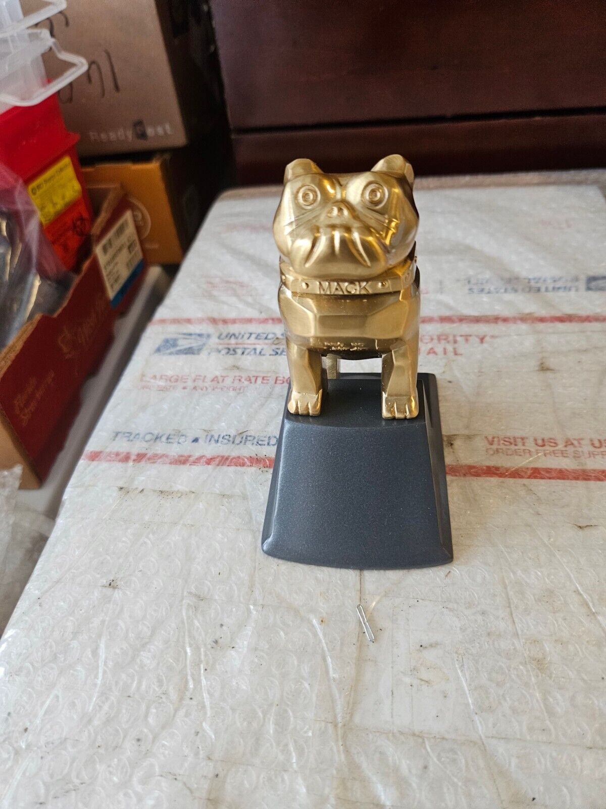 New Authentic OEM Mack Gold Plated Bulldog On Gunmetal Base With a Minor Defect