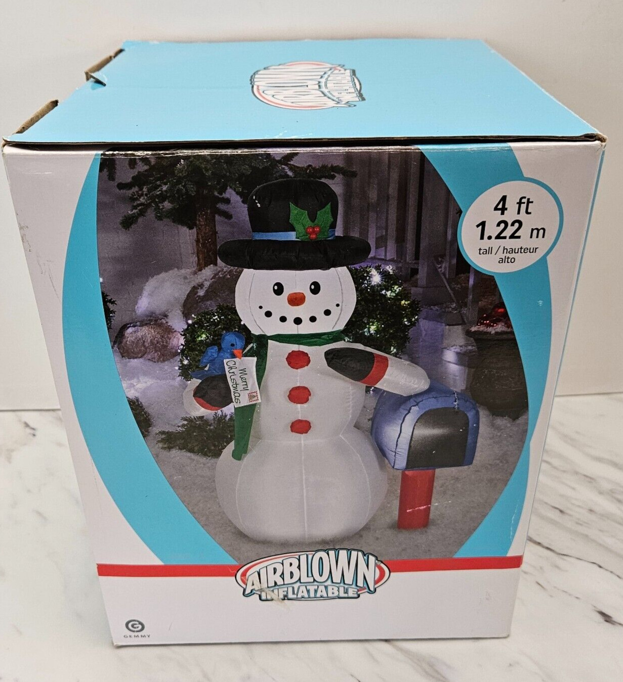 Airblown inflatable snowman with bird & mailbox. 4’ Tall. Lights up for outdoor