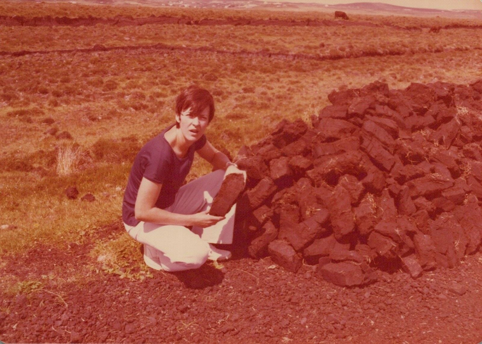 Vintage Found Photo - 1975 - Pretty Woman Holds Clumps Of Dirt Or Rocks Ireland