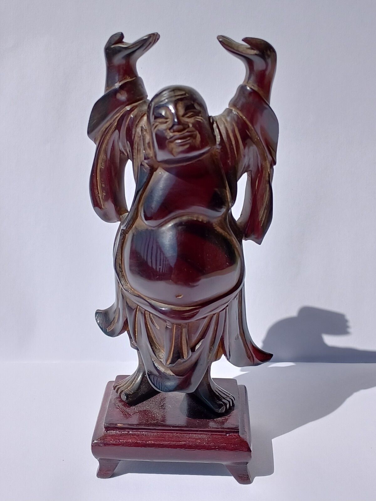 Vintage Chinese Cherry Amber Bakelite Faturan Carved Buddha On Wooden Stand