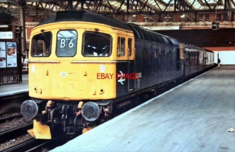 PHOTO  CLASS 33013 AT WATERLOO WITH A SHORT PARCELS TRAIN