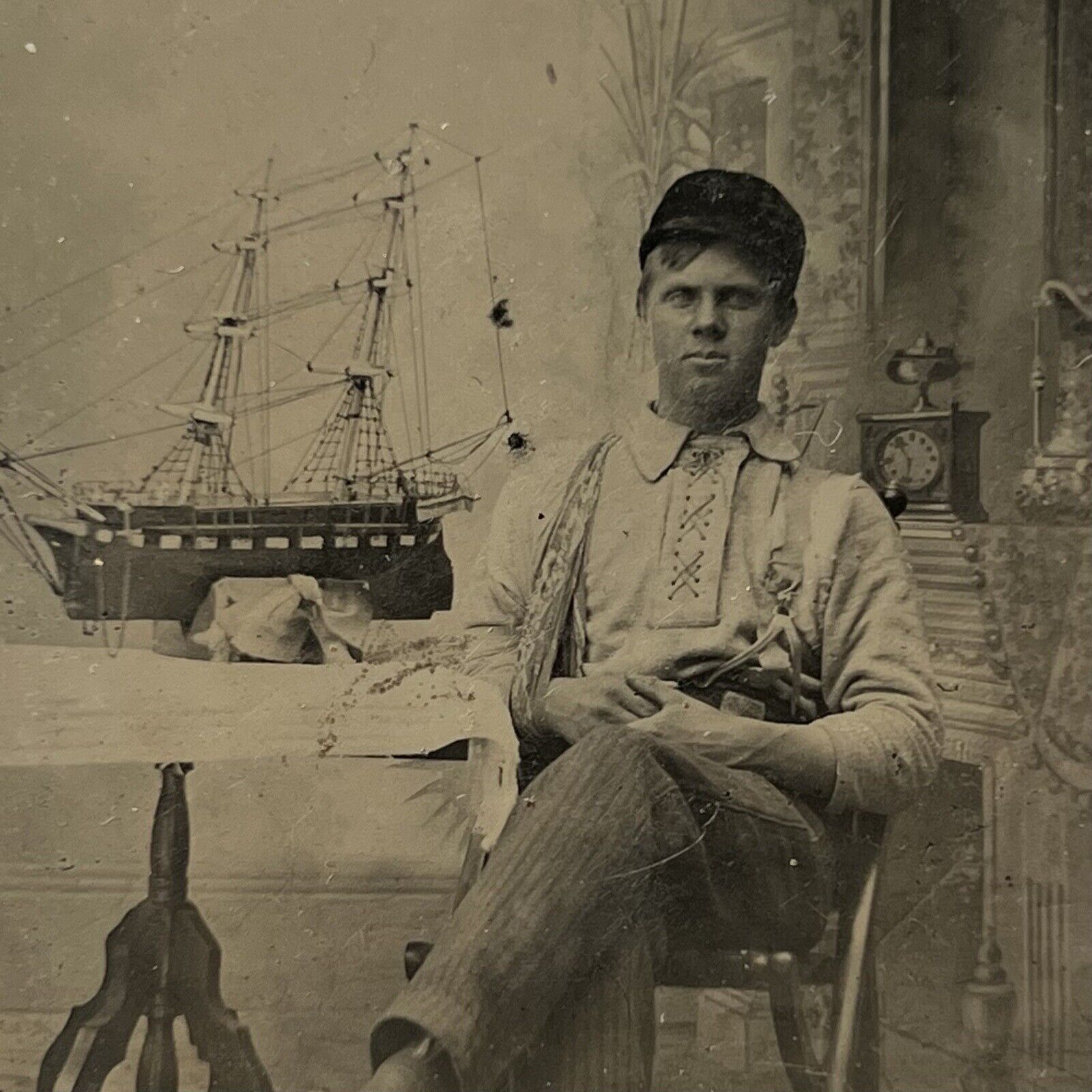 Antique Tintype Photograph Handsome Young Man Arm In Sling Hat Model Ship Odd