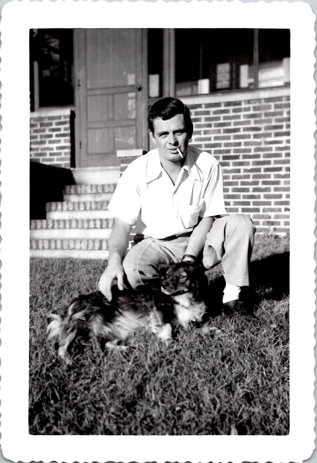 HANDSOME GAY MAN SMOKING CIGARETTE PETTING HIS DOG ~ 1950s VINTAGE GAY PHOTO