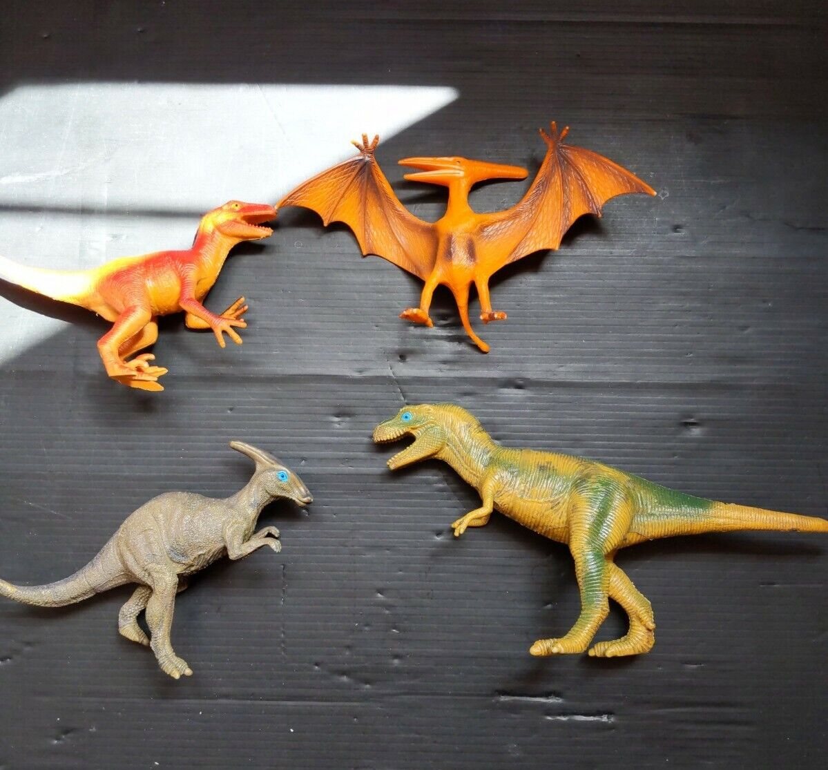 Lot of 4 Dinosaur Figures assorted sizes and species Made In China. B9