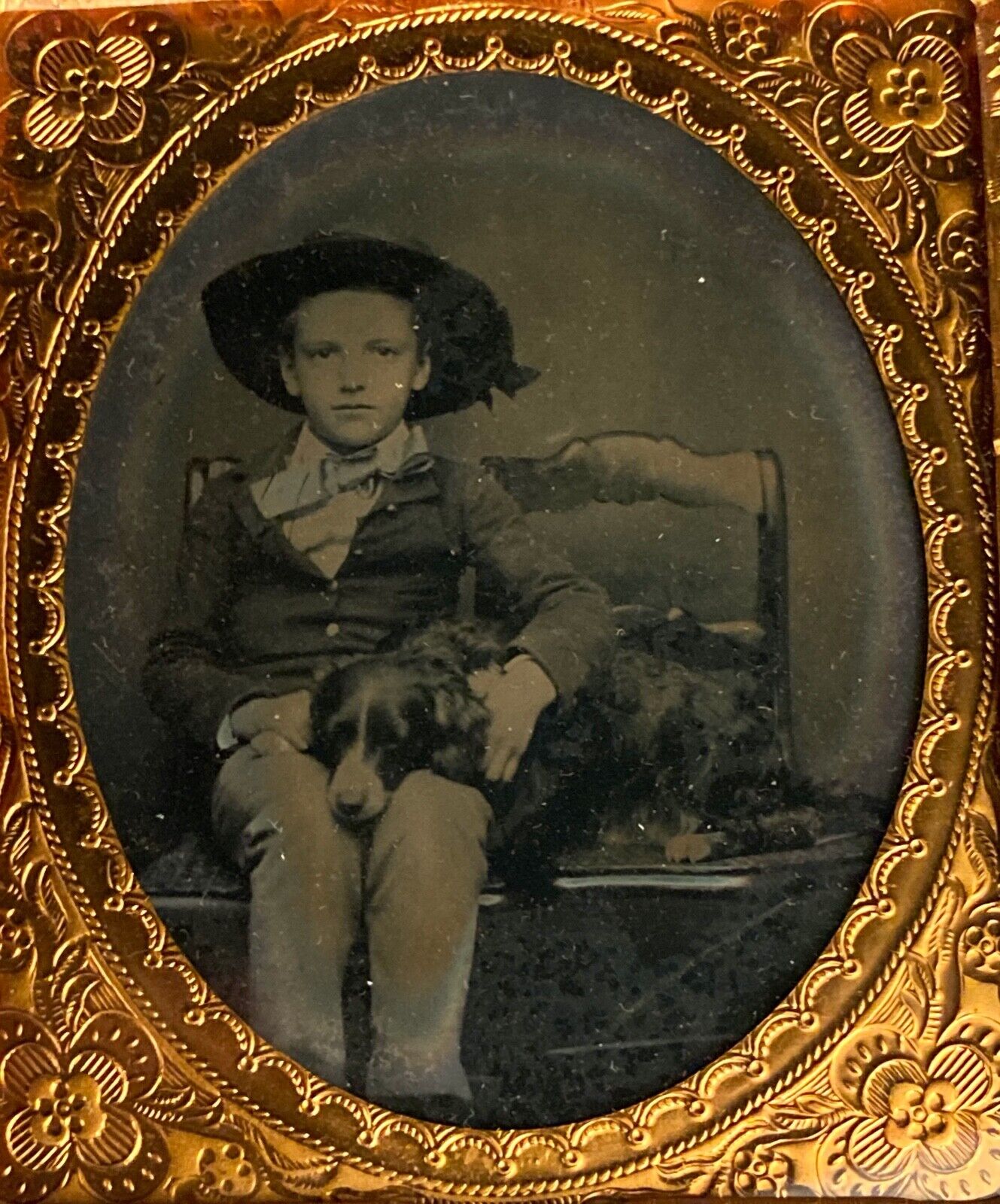 1/6 PLATE AMBROTYPE OF YOUNG BOY WITH WIDE-BRIMMED HAT + PET DOG ON HIS LAP