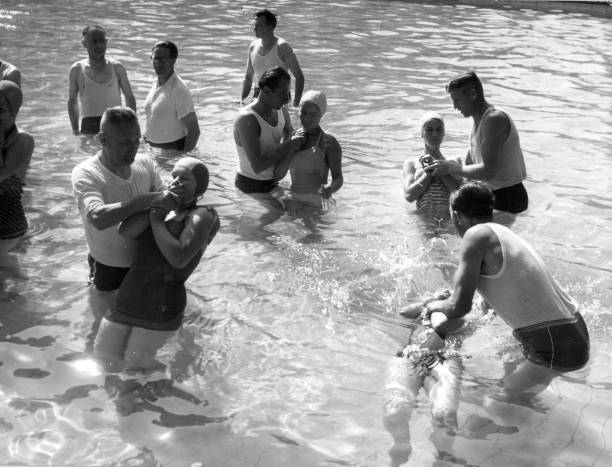 Jehovah\'s Witnesses being baptised by complete immersion Old Photo