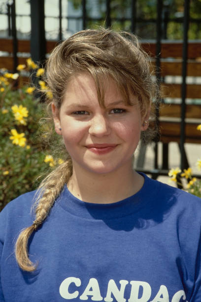 America child actress Candace Cameron wearing a blue t-shirt 'Cand- Old Photo 1