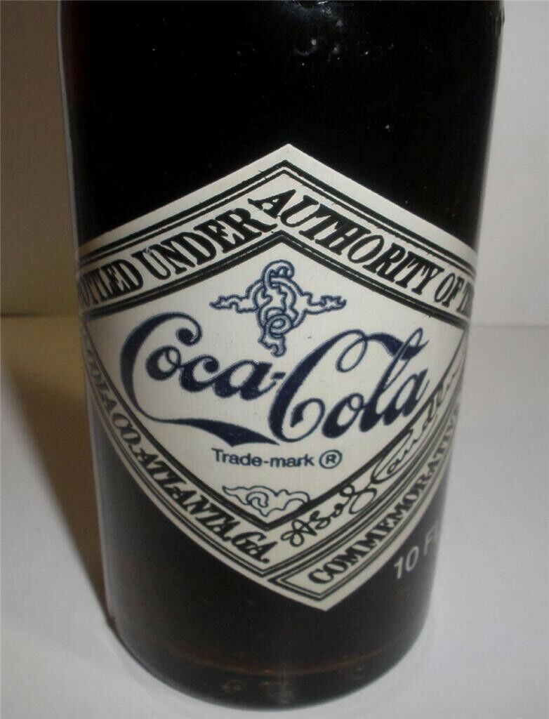 Coca-cola 75th Anniversary  bottle of coke full unopened 1899-1974