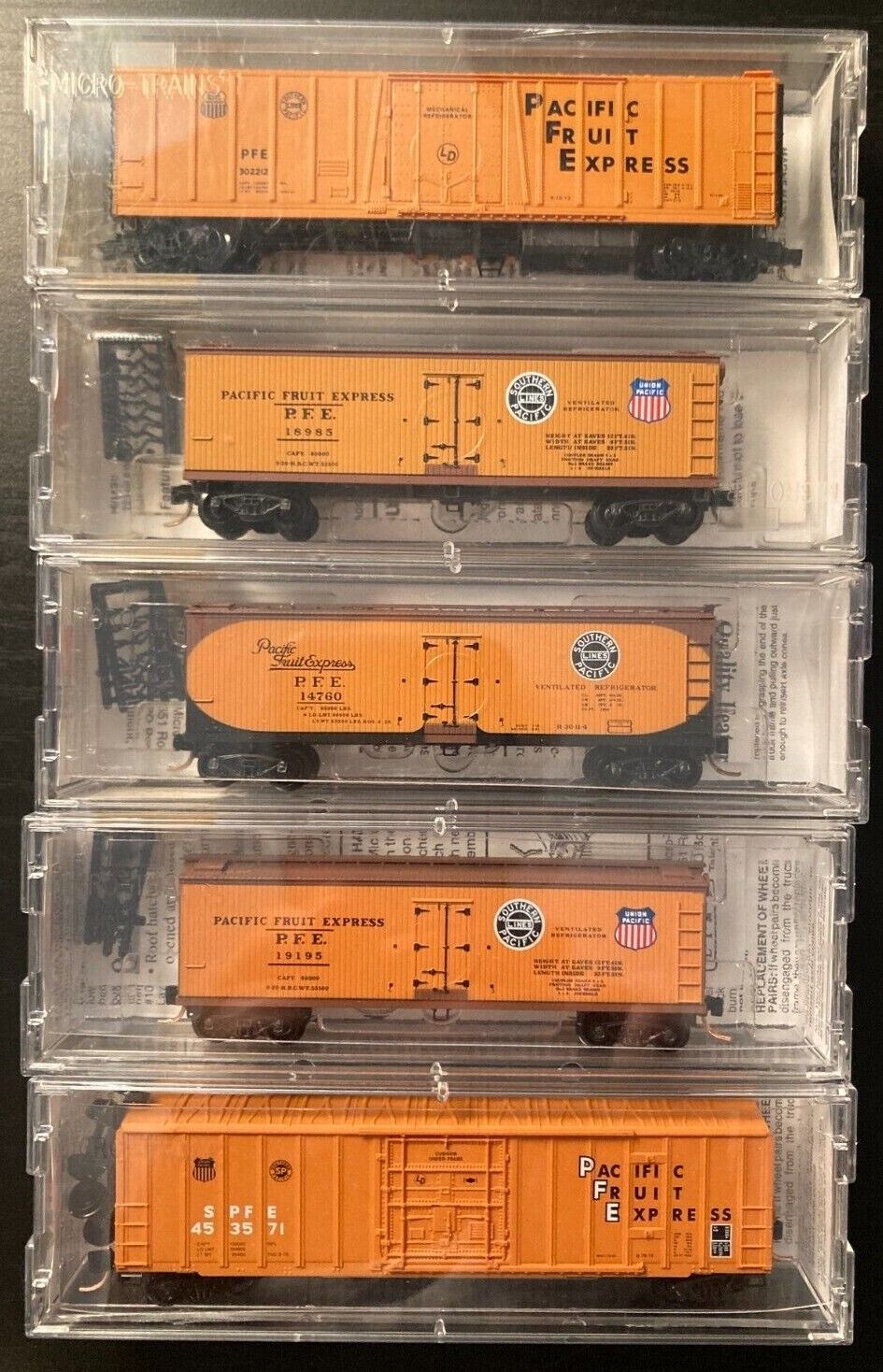 5 Micro-Trains N scale PFE reefers, #s47060 (2), 49500, 70010 and 1 box car. NIB