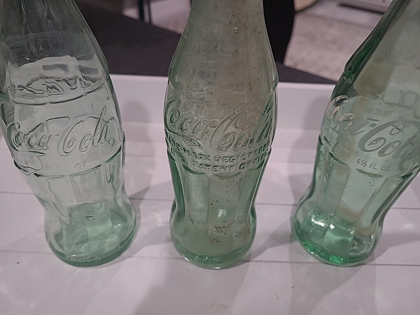 Three Vintage Coca-Cola Bottles