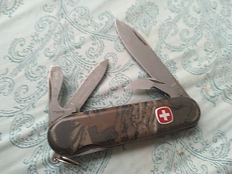 Swiss Army multi blade knife, cammoflouge pattern handle, matt finish on blades.