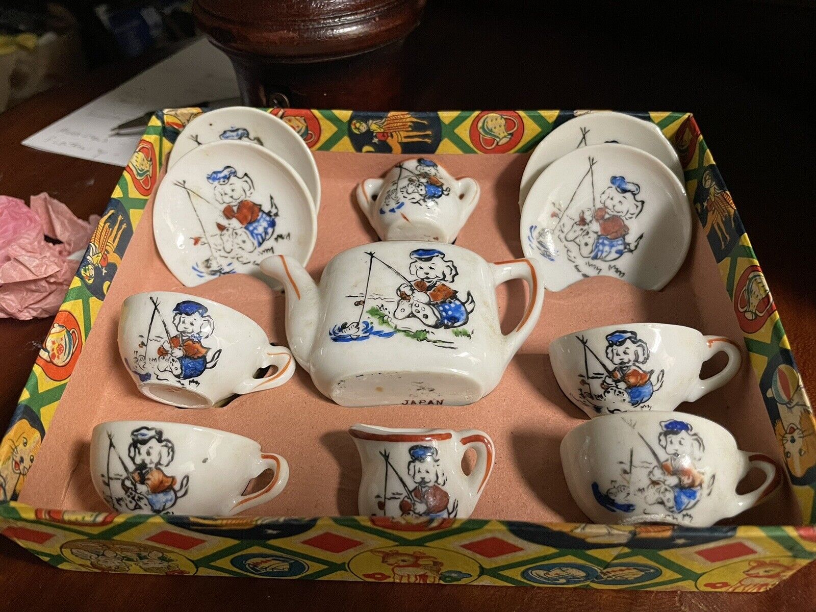Made in occupied Japan childs tea set with dog fishing