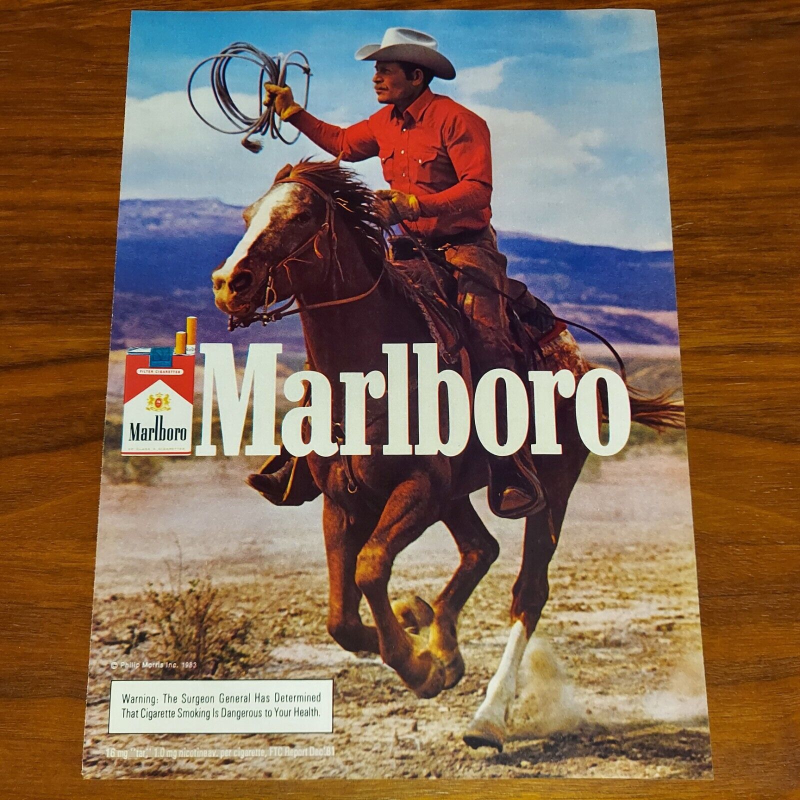 MARLBORO MAN 1983 PRINT AD MAGAZINE ADVERTISEMENT RIDING A HORSE WITH LASSO