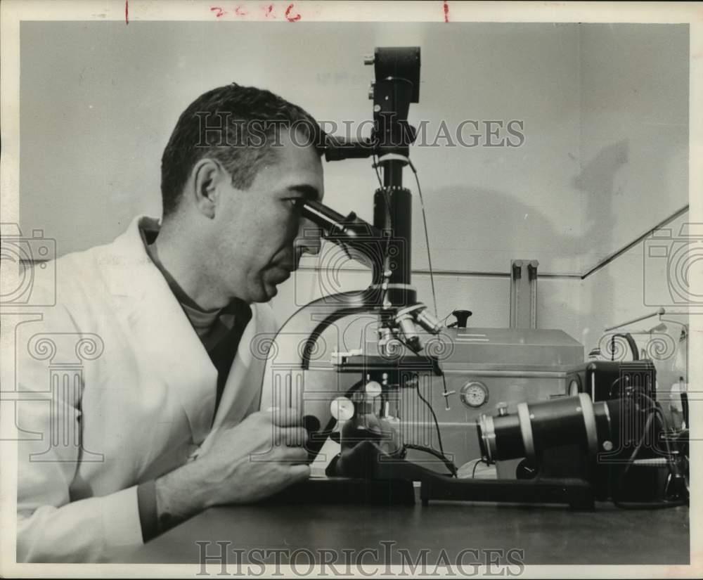 1961 Press Photo Rev. Dr. Albert Moraczewski studies mental disorders in Houston