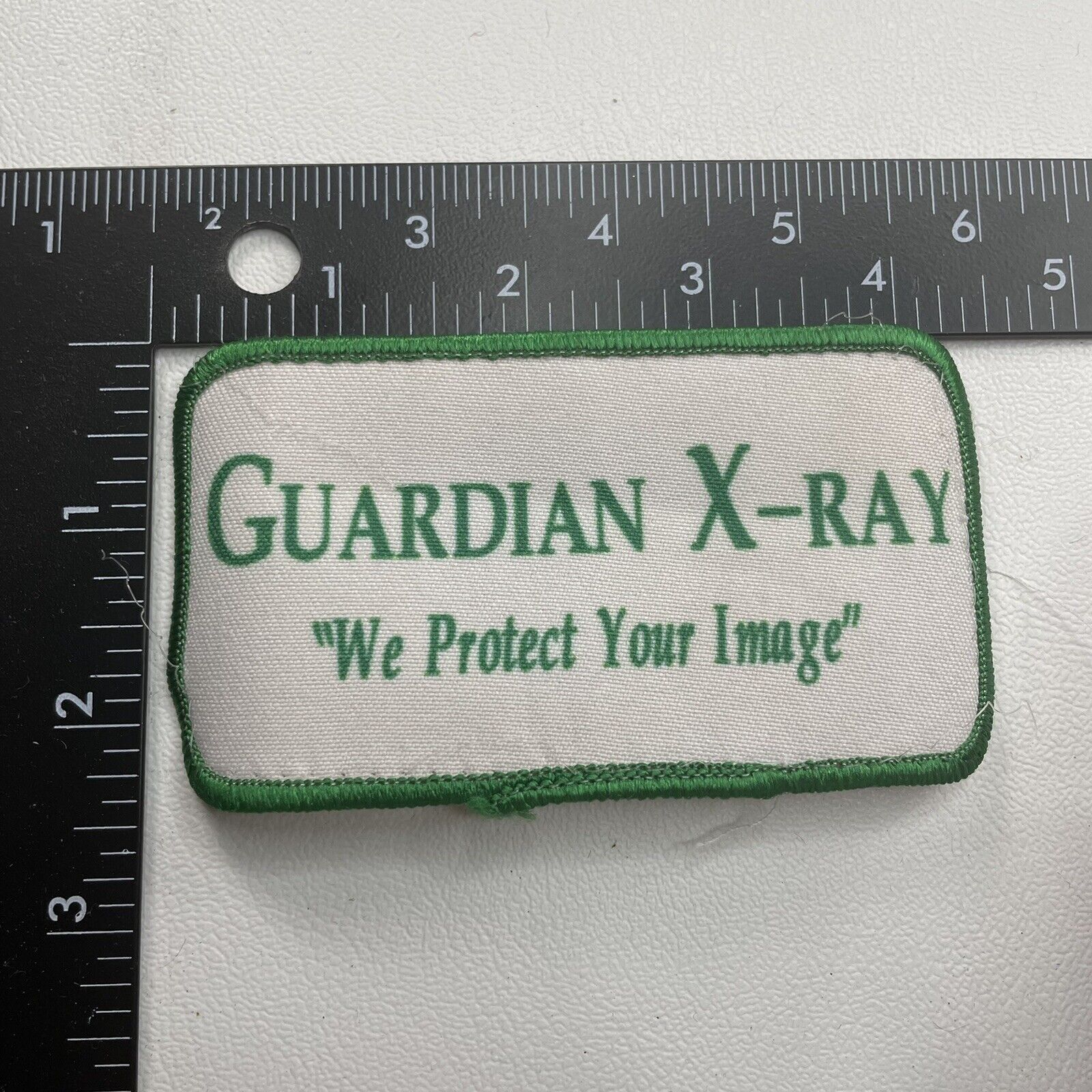 Used / Recycled GUARDIAN X-RAY WE PROTECT YOUR IMAGE Advertising Patch 12V2