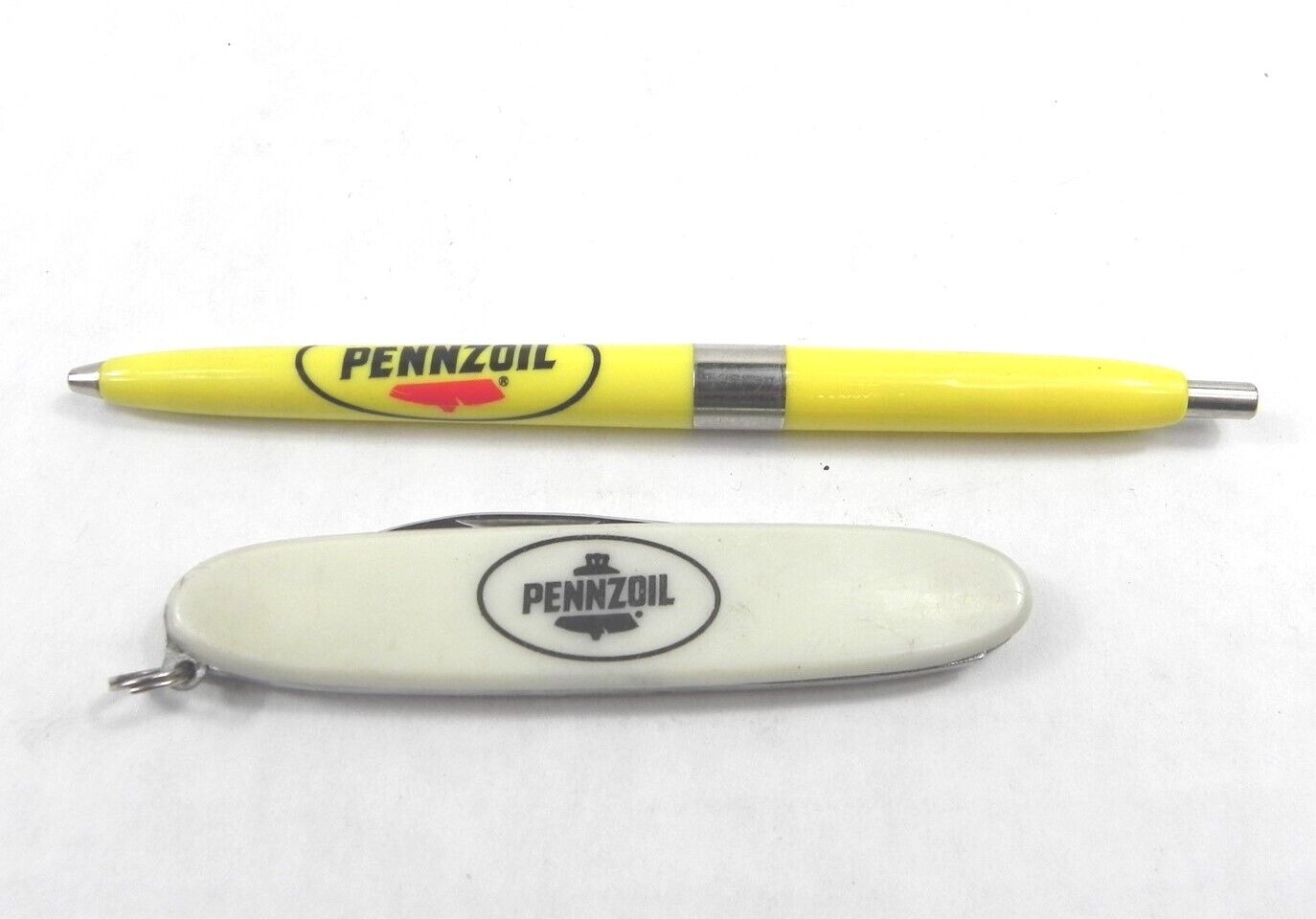 VINTAGE PENNZOIL BALLPOINT PEN AND A 2 BLADE POCKET KNIFE USED SOLD TOGETHER 