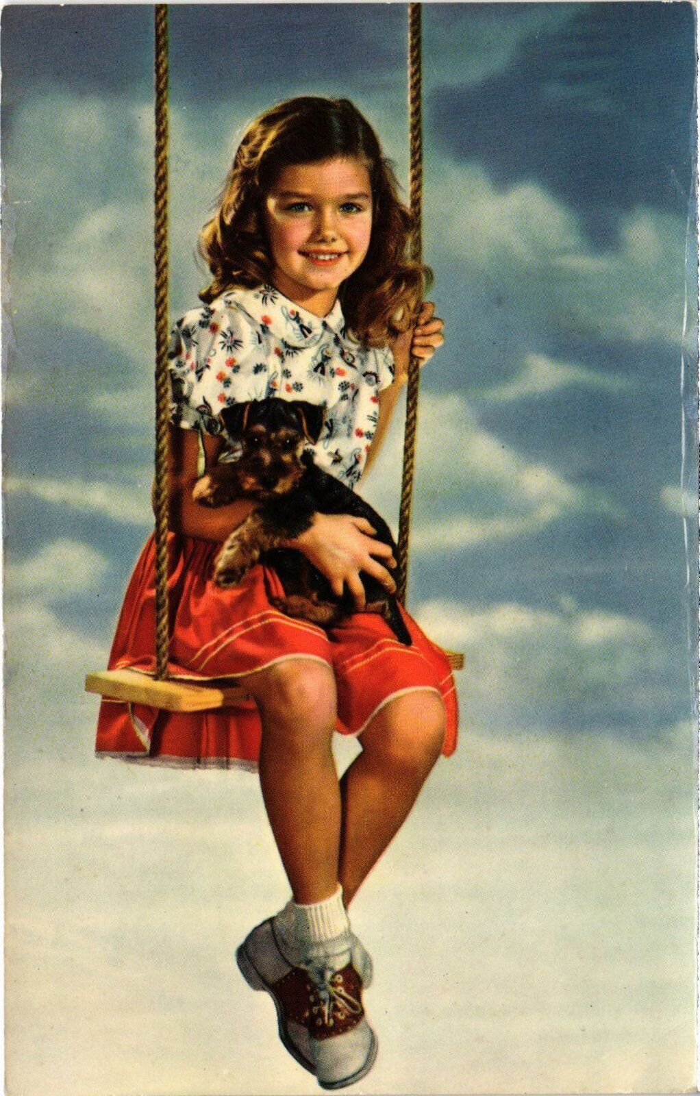 CPM AK Puppy with a Girl on a Swing DOGS (1387632)