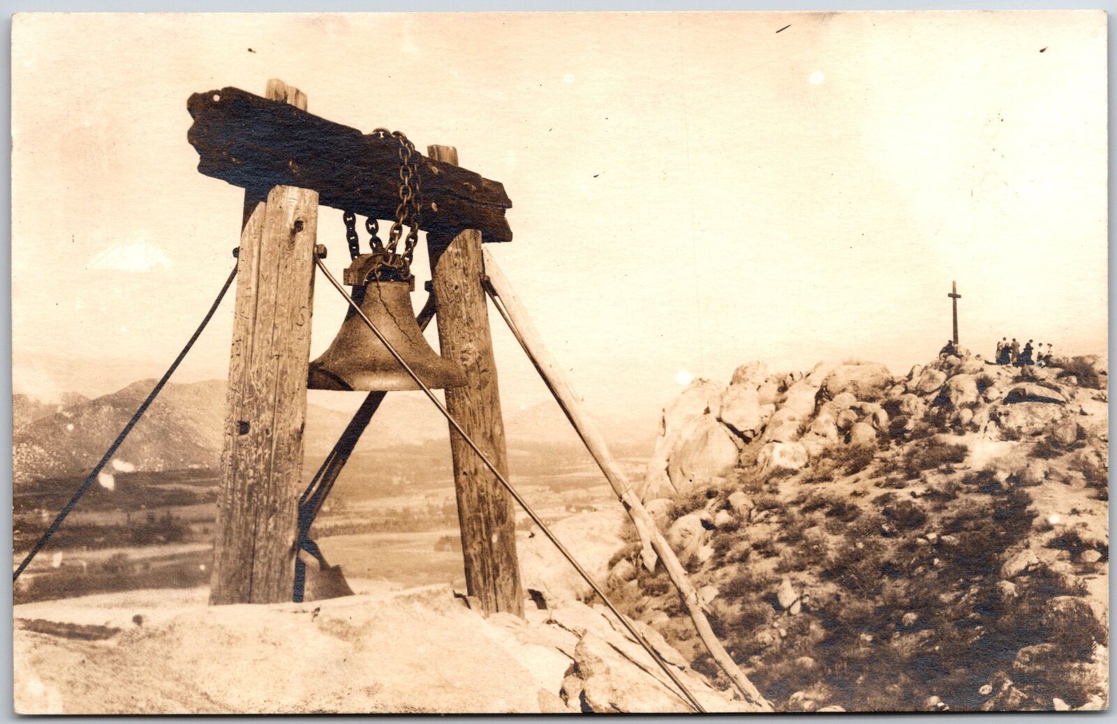 Bell Hanged On Wooden Stand Rocky Mountain Crucifix Real Photo RPPC Postcard