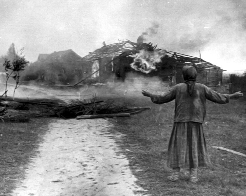Russian Woman watches her home burn 8\