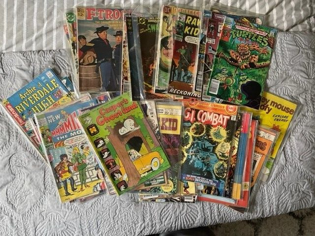 Lot of 50 Old Comics Vintage stored in plastic sleeves Marvel DC Gold Key