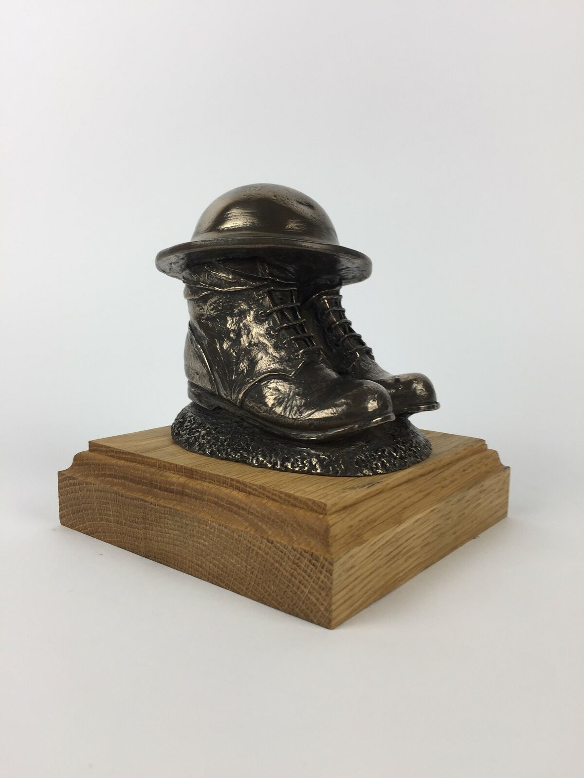 First World War Boots, Helmet, and Putty\'s Cold Cast Bronze Statue