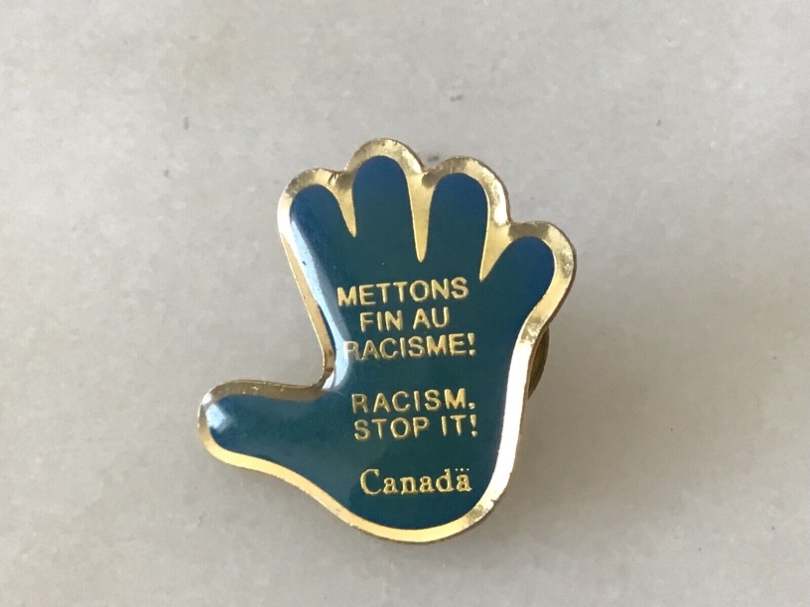 Vintage Stop Racism Canada Pin Blue Hand