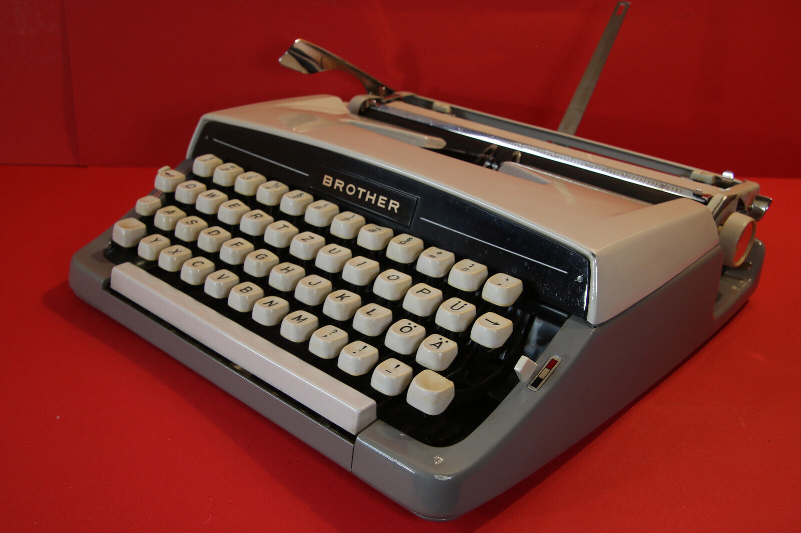 Vintage Brother grey  typewriter with own cream coloured leather like case