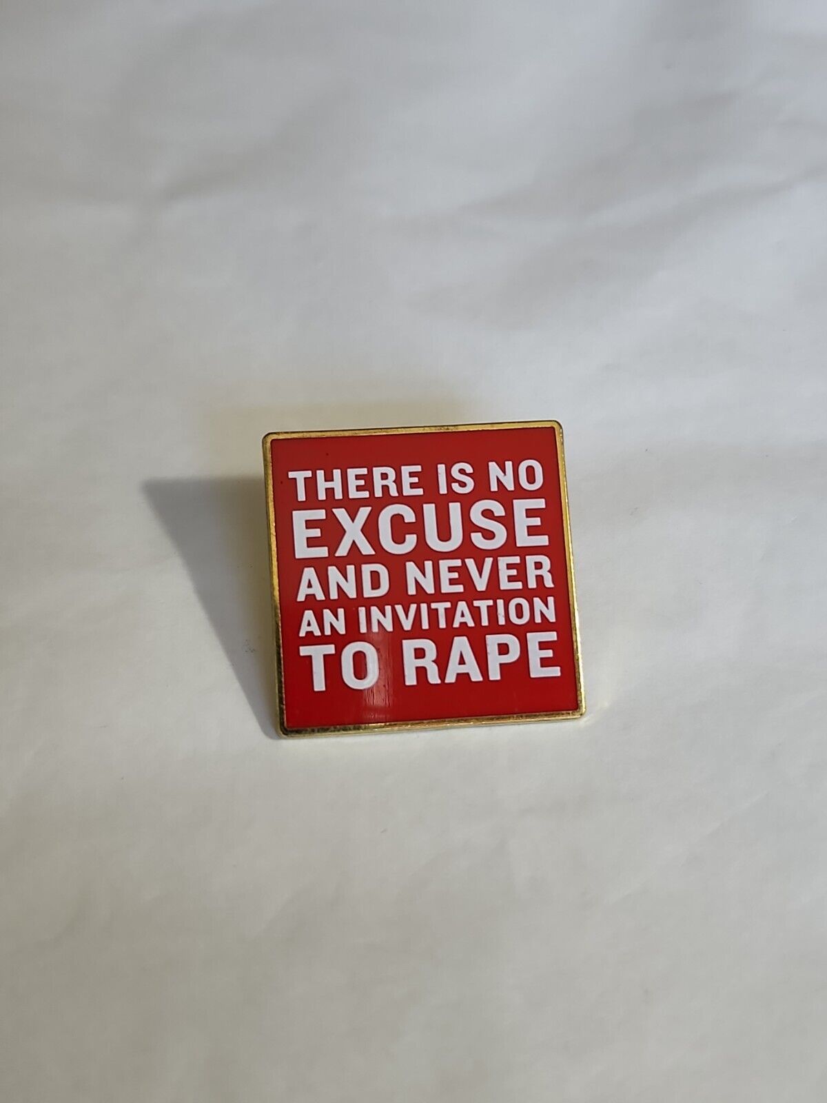 There is NO Excuse and NEVER an Invitation to Rape Lapel Pin Red & White