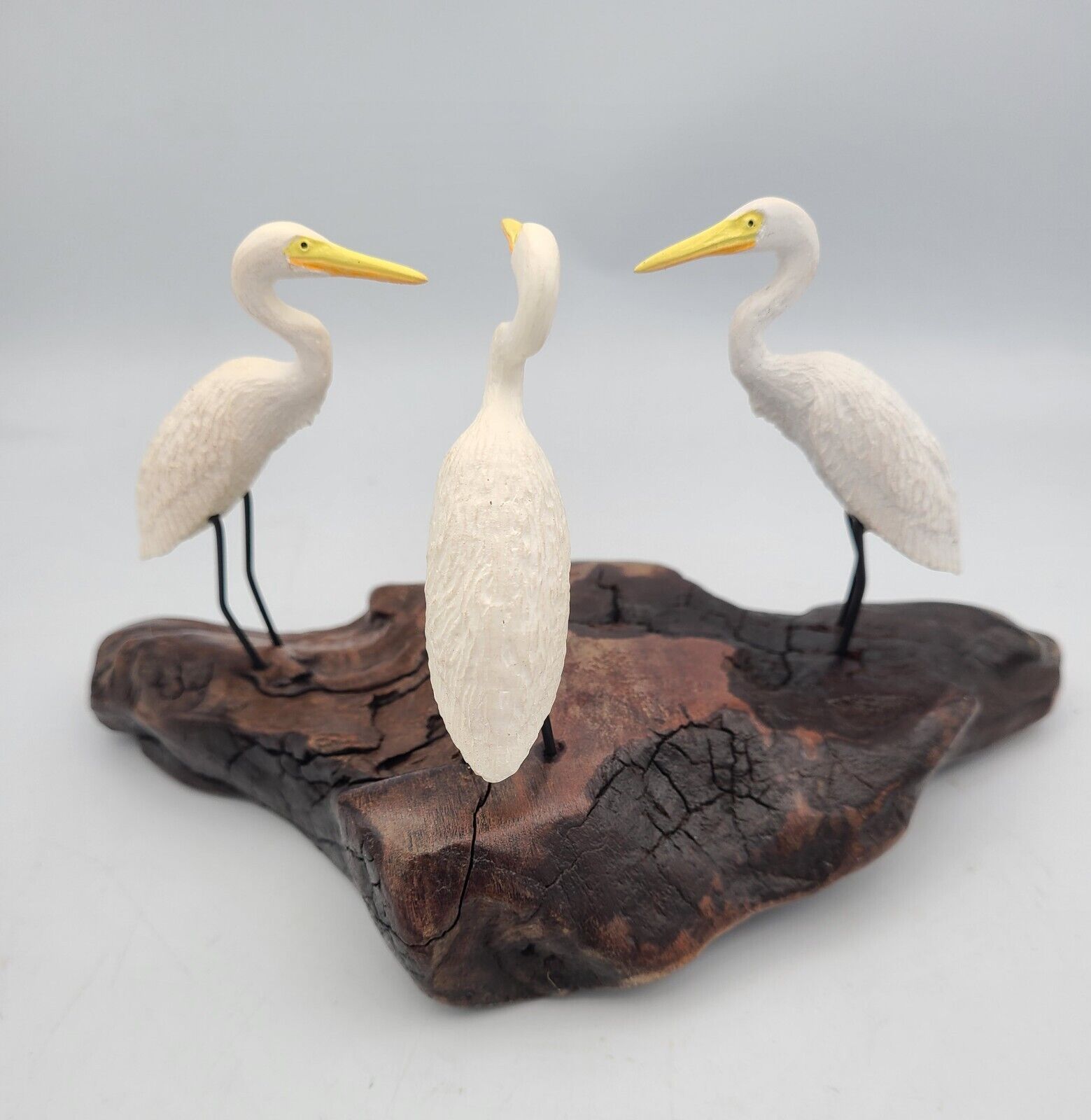 Heron trio by John Perry Sculpture on burlwood base