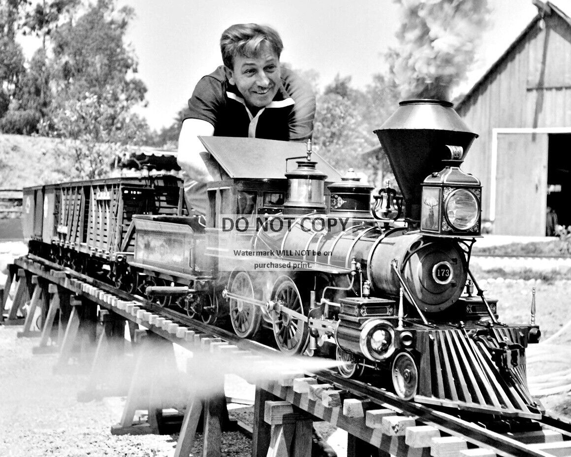 WALT DISNEY WORKING ON HIS MODEL RAILROAD TRAIN - 8X10 PHOTO (BB-634)