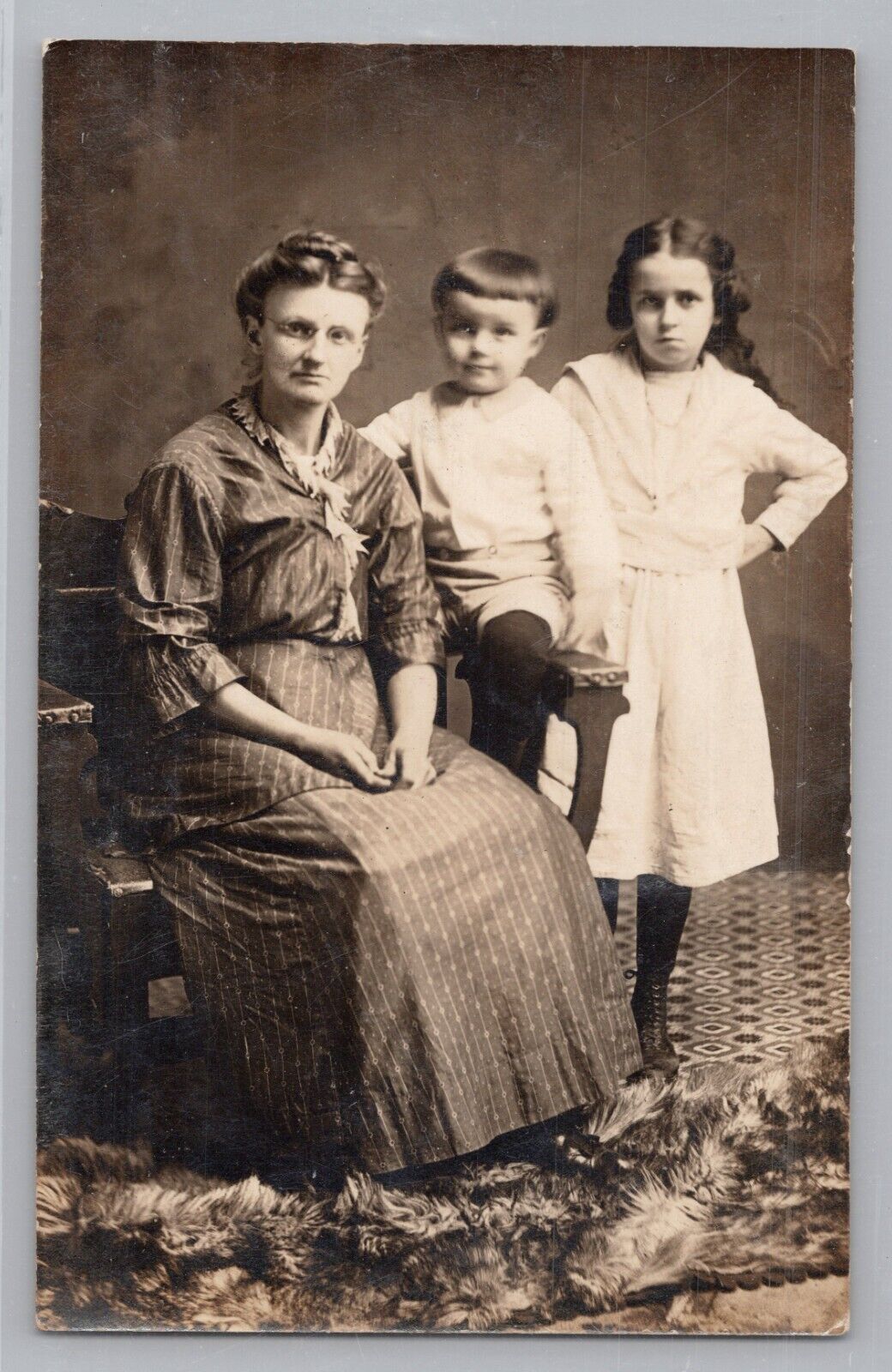 RPPC Mother, Daughter and Son In Photography Studio