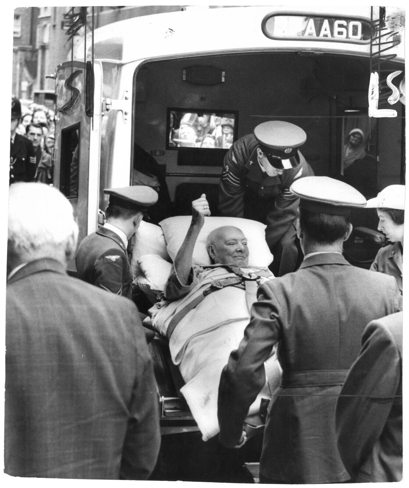 29 June 1962 press photo of Sir Winston Churchill being taken from an ambulance